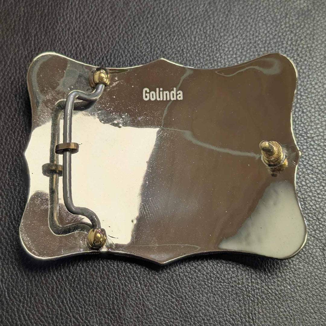 This is the back of a Tarleton State University belt buckle featuring bronze and copper words and accents.