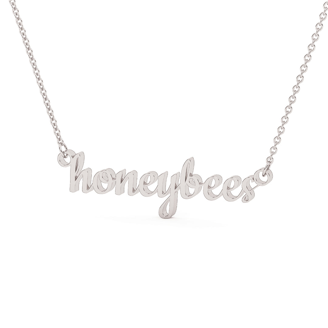 This is a Stephenville ISD pendant made from the word honeybees in a script font made in stainless steel in a white gold color.