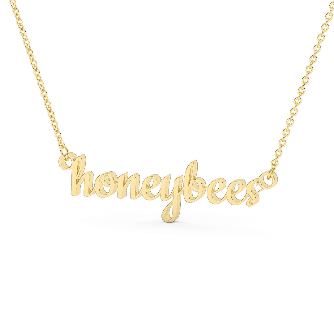 This is a Stephenville ISD pendant made from the word honeybees in a script font made in stainless steel in a gold color.