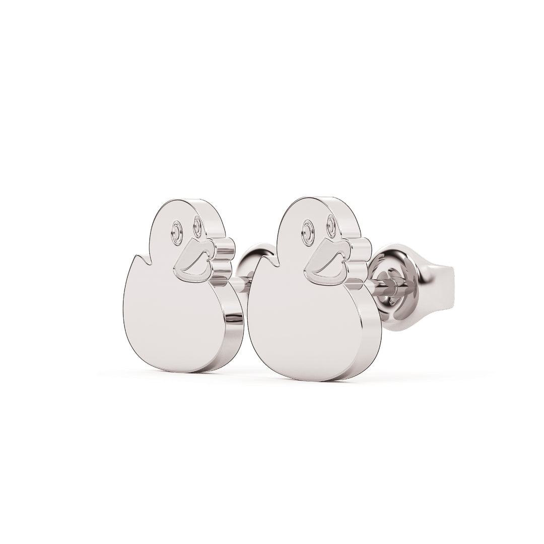 This is the secondary view looking at a 45 degree angle at a pair of duck shaped stud earrings in white stainless.