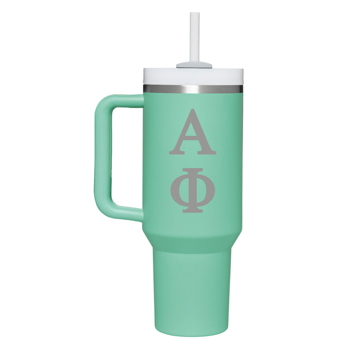 This is a stainless steel tumbler with handle and straw in teal with the greek letters for Alpha Phi engraved on the front. 