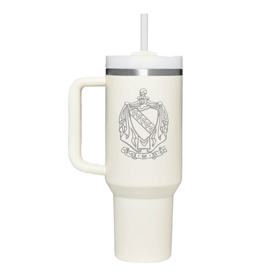 Stainless steel tumbler with Tau Kappa Epsilons crest logo engraved on a cream cup. 