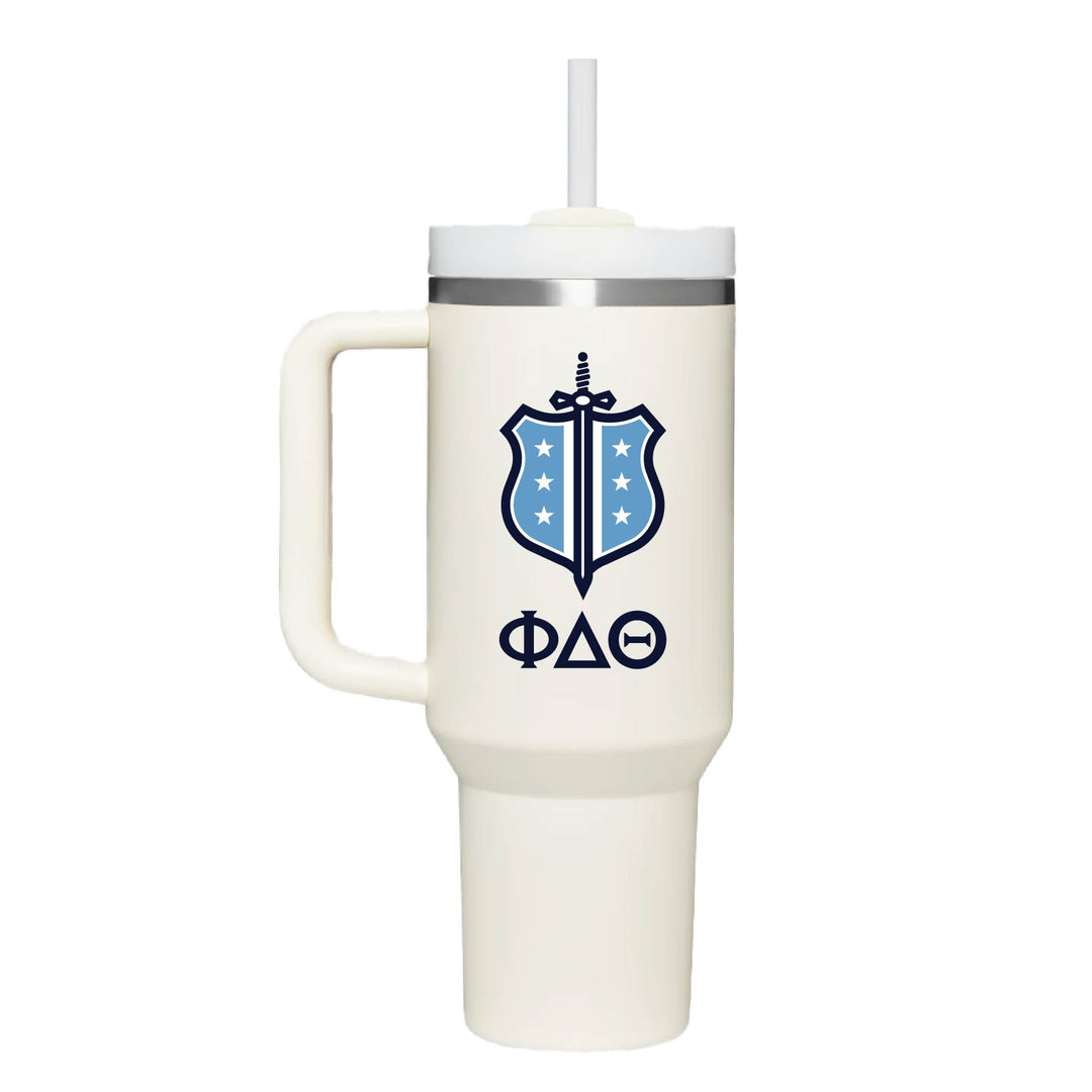 Stainless steel insulated cup with Phi Delta Theta's Shield logo with greek letters. On a cream cup. 