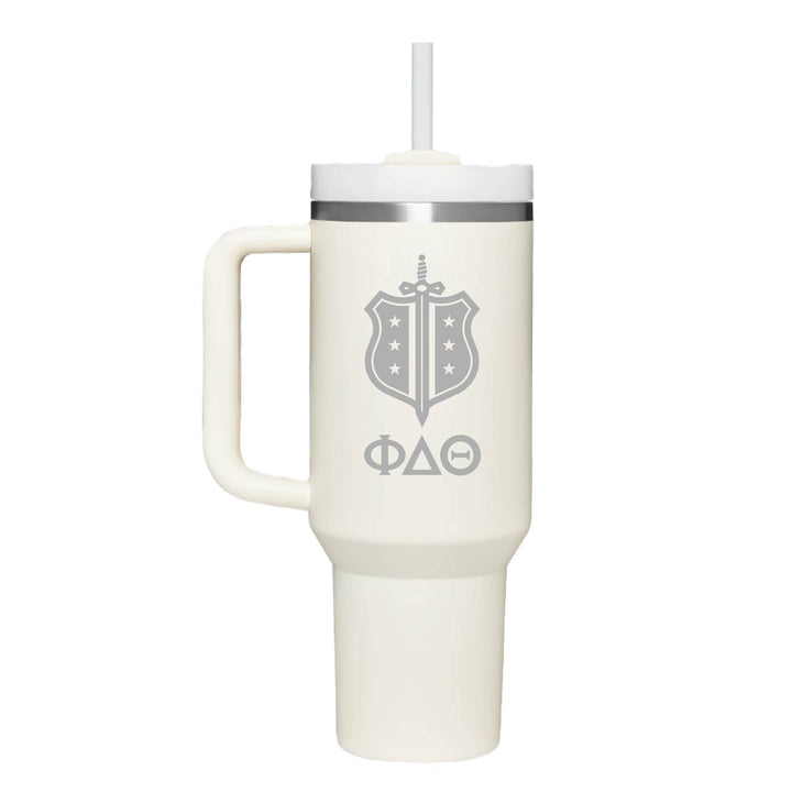 Stainless steel insulated tumbler with Phi Delta Theta's shield logo and greek letters. Cream tumbler. 