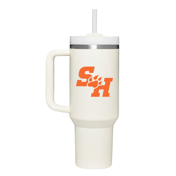 This is a stainless steel insulated cup with a handle and a lid. It features the Sam Houston State University SH Paw logo. This cup is cream.