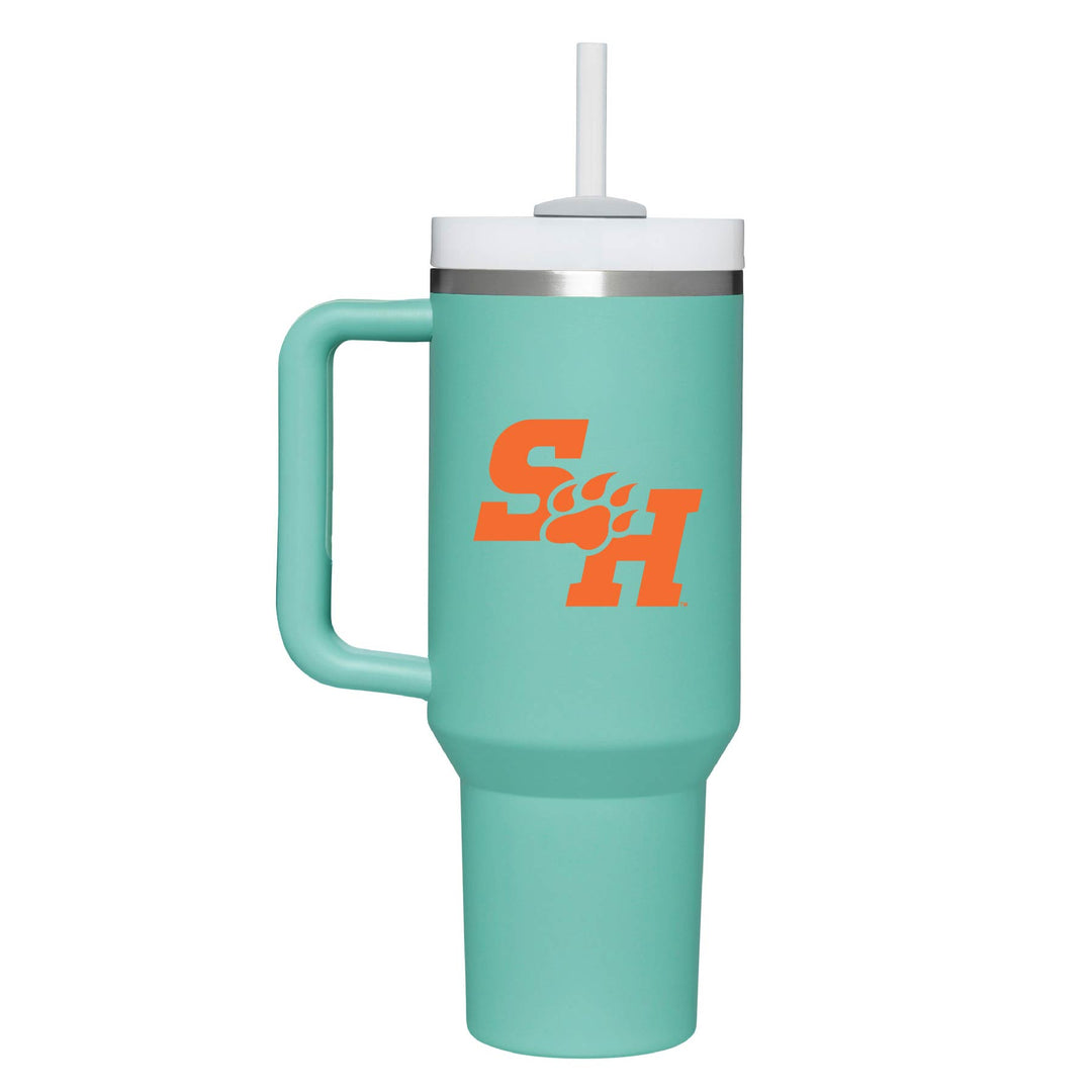 This is a stainless steel insulated cup with a handle and a lid. It features the Sam Houston State University SH Paw logo. This cup is eucaluptus.