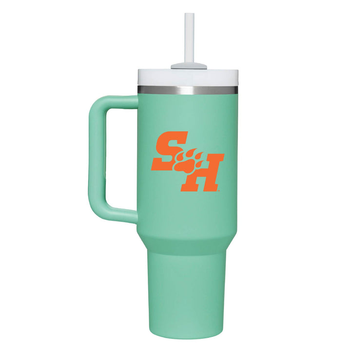 This is a stainless steel insulated cup with a handle and a lid. It features the Sam Houston State University SH Paw logo. This cup is teal.