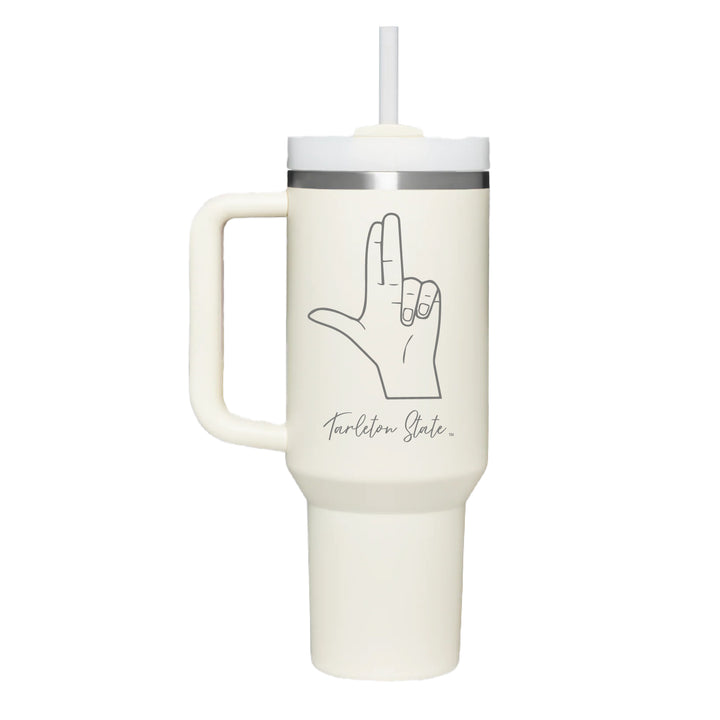 Stainless cream colored handle tumbler with the Tarleton Handsign in script engraved on the front.